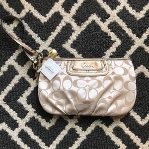 Coach clutch purse. Never used, tag still on.